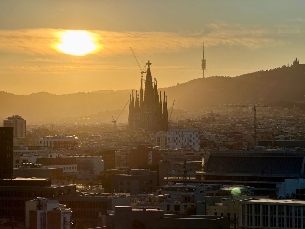 Sunset over Barcelona with the Sagrada Familia on the skyline, taken during the CHI 2026 trip